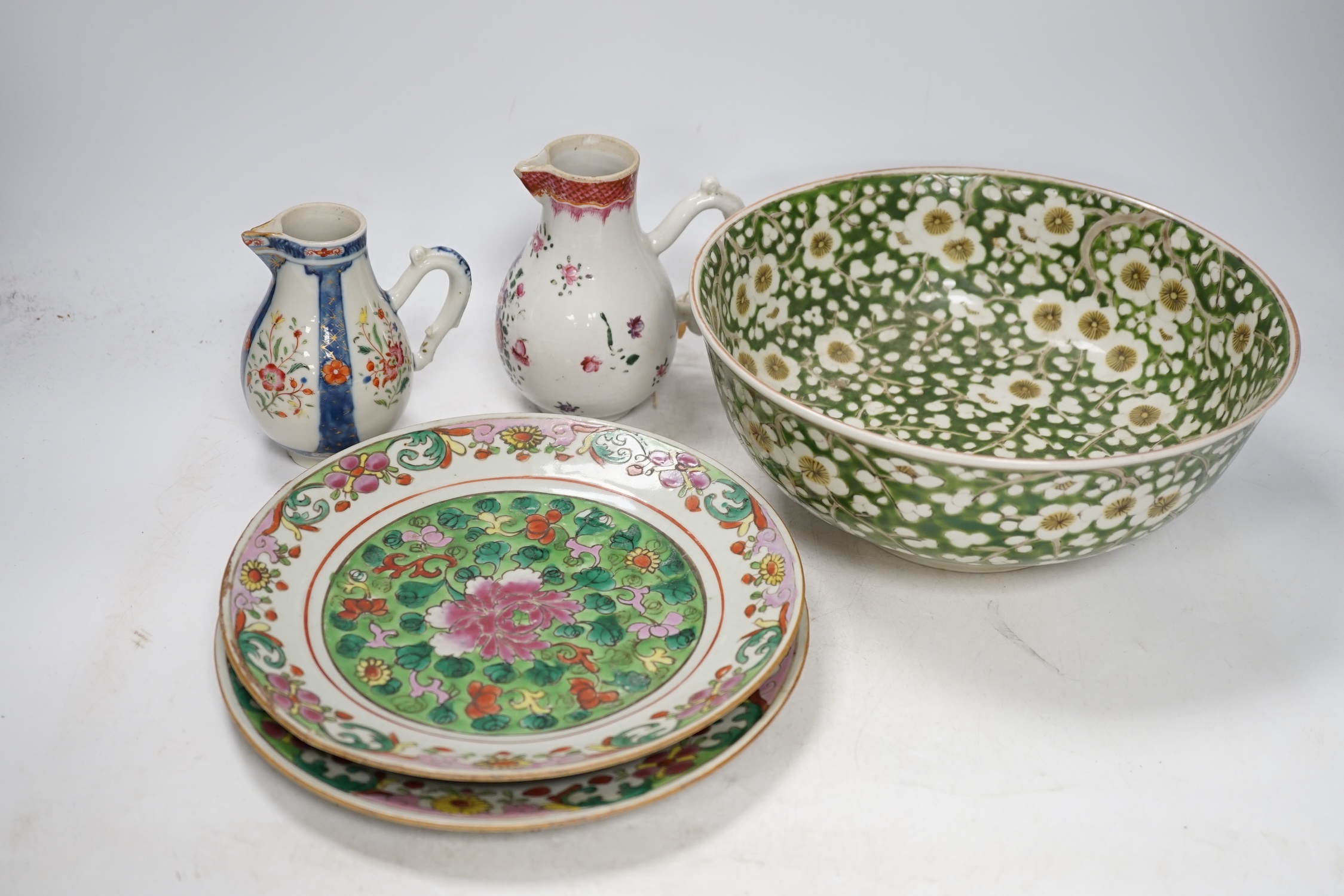 Two 18th century Chinese export porcelain jugs, a pair of famille rose plates made for the Thai market and a Japanese floral bowl, 24cm. Condition - varies